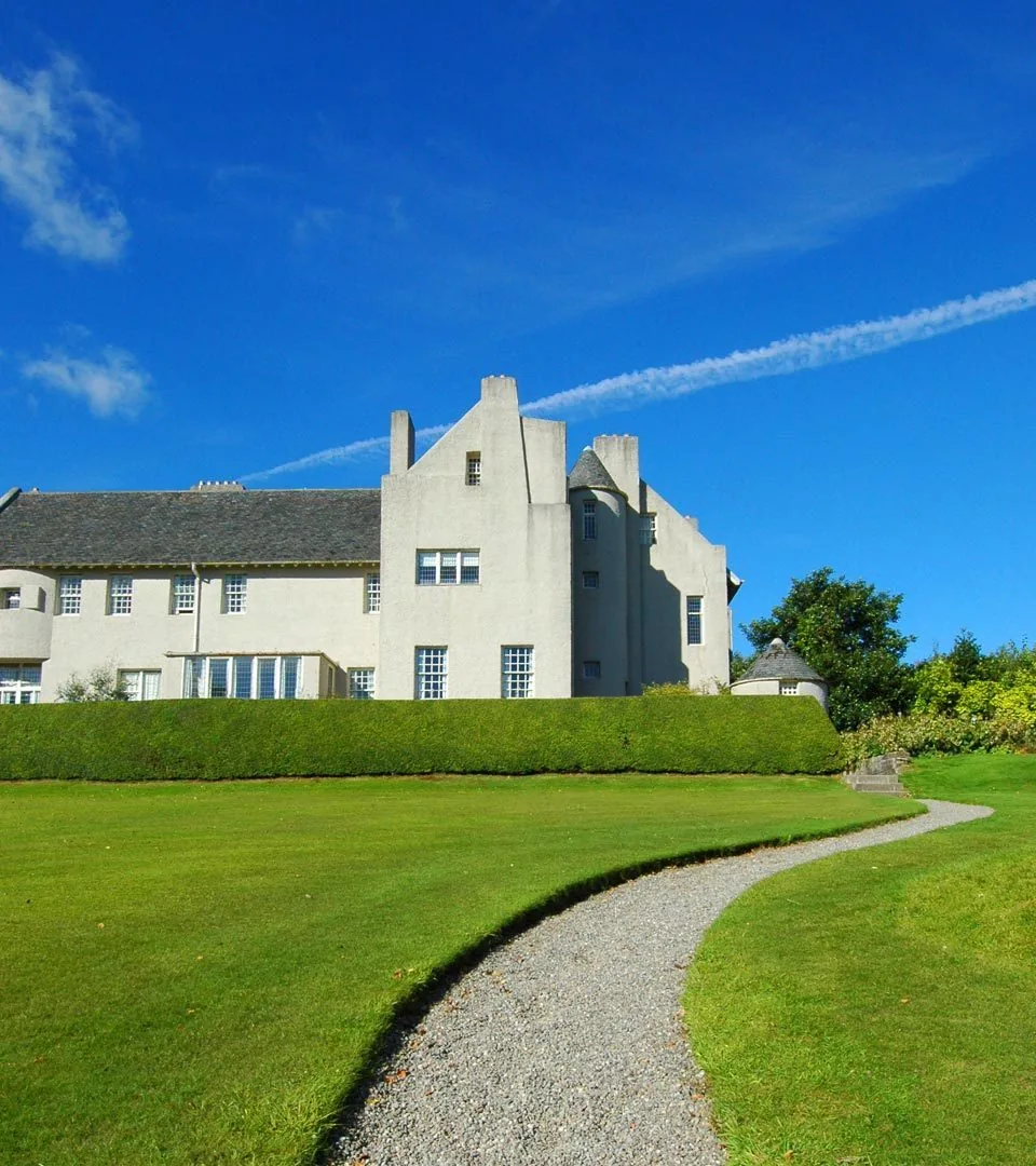 Large country house with a long formal hedge and lawn in Helensburgh
