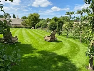 Neatly striped lawn in a large private garden in Milngavie